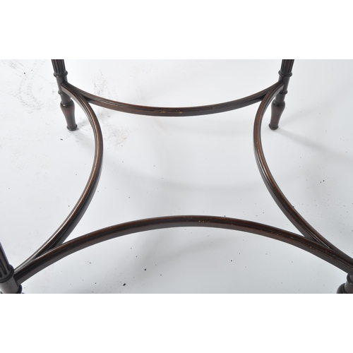 42 - An early 20th Century Edwardian mahogany centre table of circular form. Rosettes to the frieze with ... 