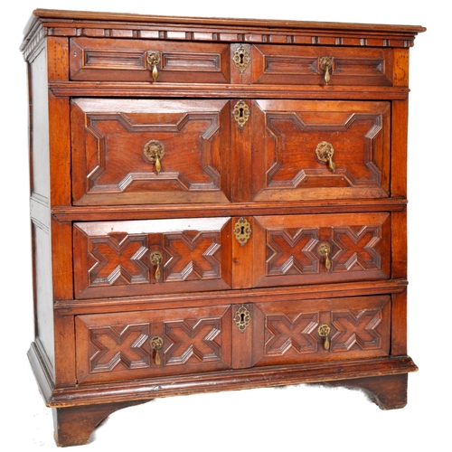 421 - A 17th Century Jacobean solid carved oak chest of drawers having chamfered edge top over a configura... 