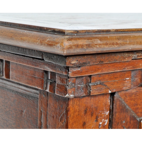 421 - A 17th Century Jacobean solid carved oak chest of drawers having chamfered edge top over a configura... 