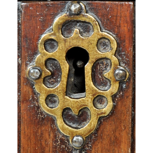 421 - A 17th Century Jacobean solid carved oak chest of drawers having chamfered edge top over a configura... 