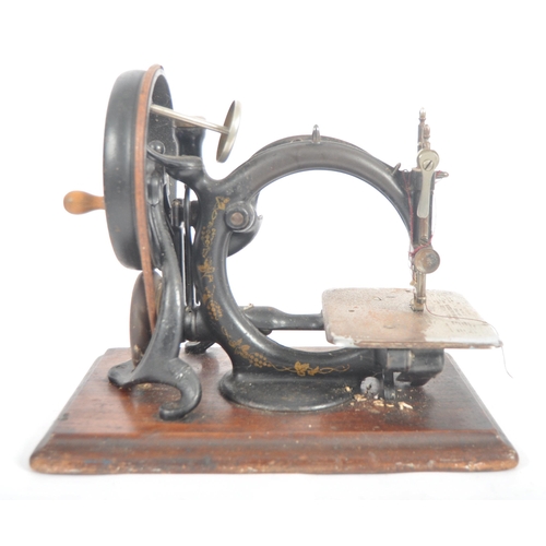 430 - A late 19th century American Willcox and Gibbs of New York hand sewing machine. C-frame hand-cranked... 