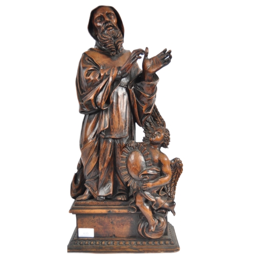 435 - An 18th Century carved walnut figurine group depicting religious figure in hooded robe having winged... 