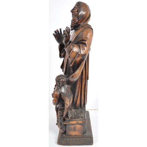 435 - An 18th Century carved walnut figurine group depicting religious figure in hooded robe having winged... 