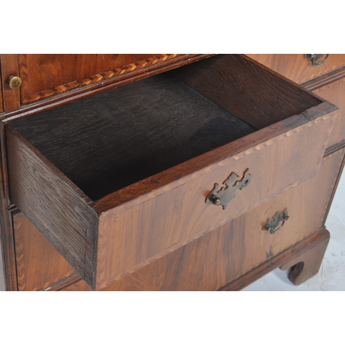 443 - A 20th Century Queen Anne style double dome walnut bureau bookcase having a twin arched top bookcase... 