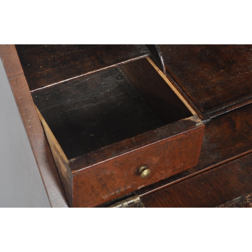 443 - A 20th Century Queen Anne style double dome walnut bureau bookcase having a twin arched top bookcase... 