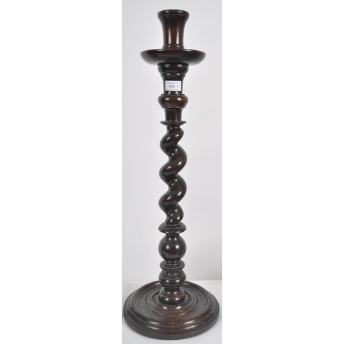 444 - A early 20th century ecclesiastical barley twist candlestick. Of large proportions, on a barley twis... 