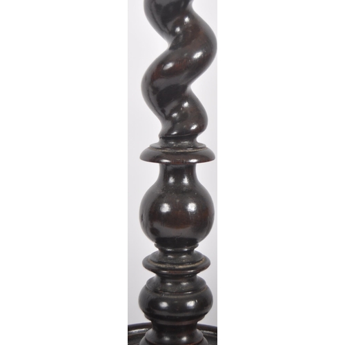 444 - A early 20th century ecclesiastical barley twist candlestick. Of large proportions, on a barley twis... 