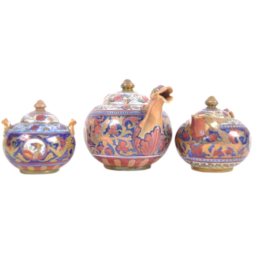 449 - An early 20th Century Italian faience pottery three part tea service of large size. Hand painted dec... 