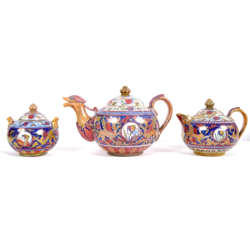 449 - An early 20th Century Italian faience pottery three part tea service of large size. Hand painted dec... 