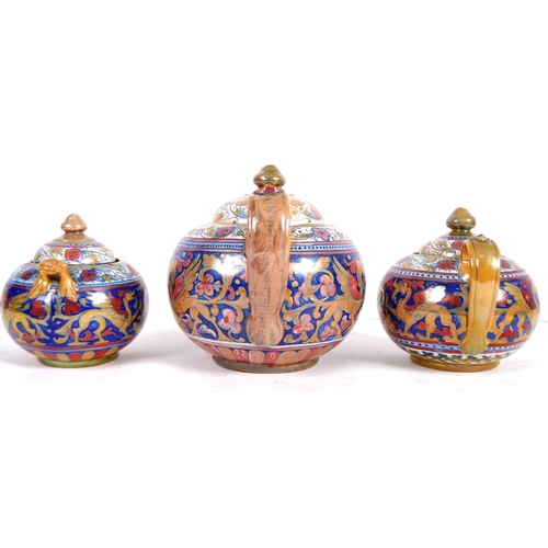 449 - An early 20th Century Italian faience pottery three part tea service of large size. Hand painted dec... 