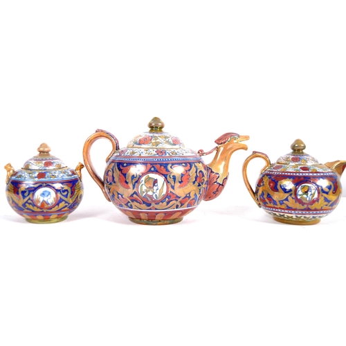 449 - An early 20th Century Italian faience pottery three part tea service of large size. Hand painted dec... 