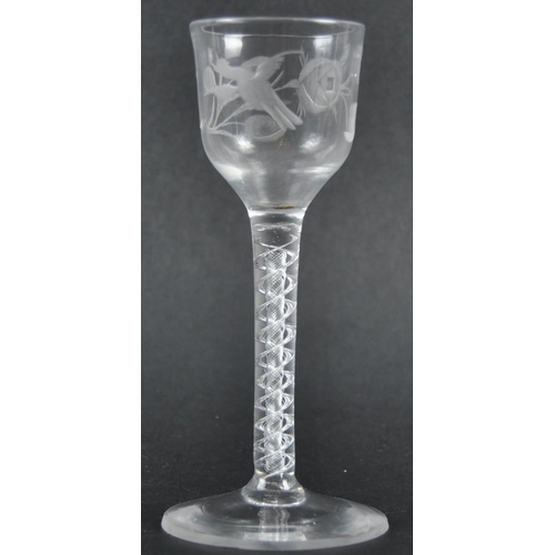 45 - An 18th Century engraved double series air twist wine glass of possible Jacobite significance. Ogee ... 