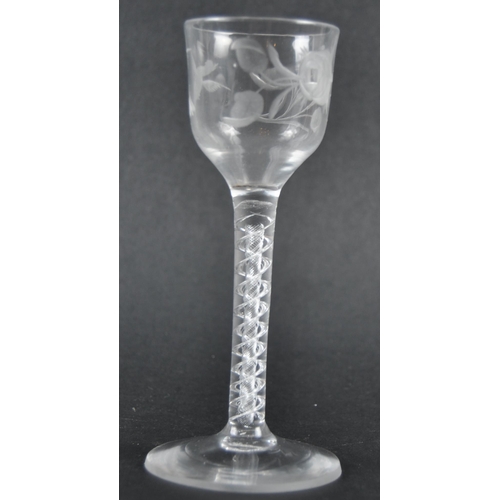 45 - An 18th Century engraved double series air twist wine glass of possible Jacobite significance. Ogee ... 