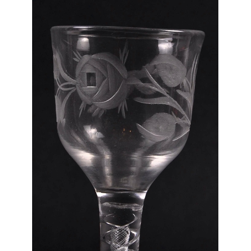 45 - An 18th Century engraved double series air twist wine glass of possible Jacobite significance. Ogee ... 