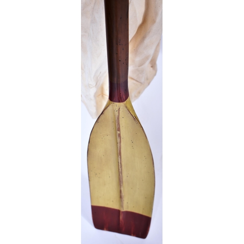 451 - A late 20th Century coat / stick oar stand constructed from three rowing oars united by a turned fin... 