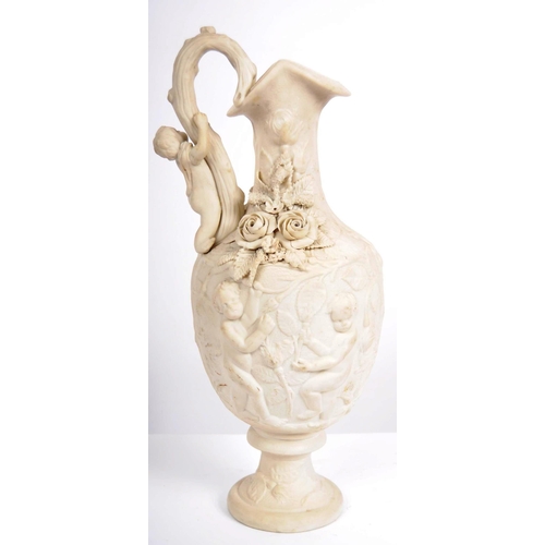 457 - A 19th Century Parian ware ewer jug pitcher of large size having relief moulded decoration depicting... 