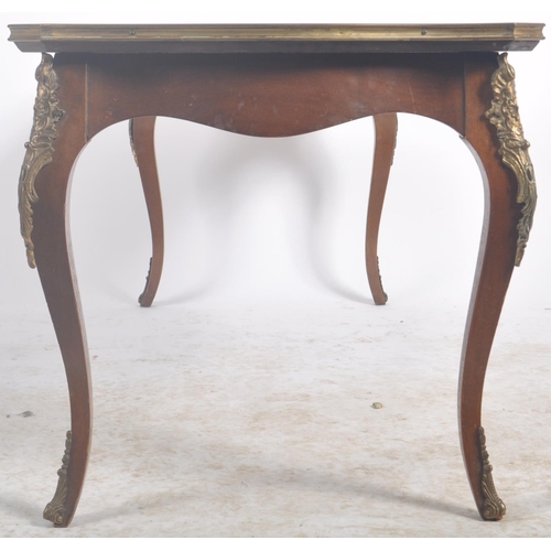 46 - A 20th Century French Empire revival kingwood coffee table / low occasional table. Serpentine shaped... 