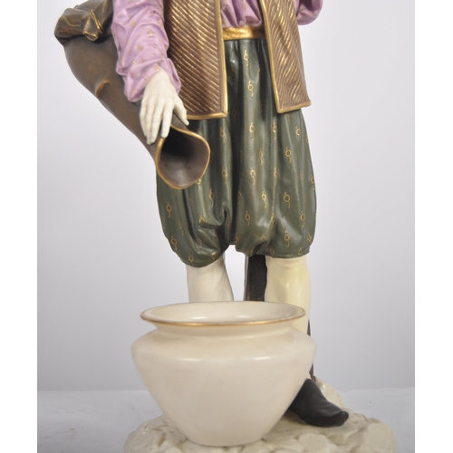 462 - A 19th Century Hadley's Worcester large porcelain figurine depicting a male water carrier. The figur... 