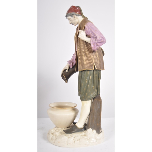 462 - A 19th Century Hadley's Worcester large porcelain figurine depicting a male water carrier. The figur... 