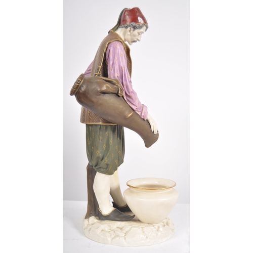 462 - A 19th Century Hadley's Worcester large porcelain figurine depicting a male water carrier. The figur... 