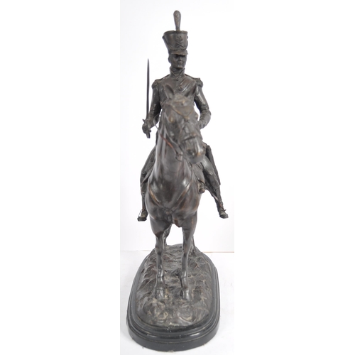 473 - A 19th Century large bronze figurine depicting a Napoleonic officer mounted on horseback. The large ... 