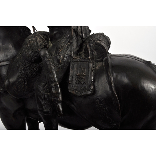 473 - A 19th Century large bronze figurine depicting a Napoleonic officer mounted on horseback. The large ... 