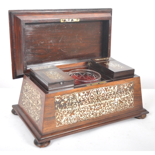 478 - A 19th Century Victorian rosewood and mother of pearl inlay tea caddy of sarcophagus form. Intricate... 