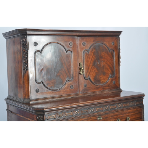 48 - A large 19th Century Victorian mahogany cupboard on chest having a double door cupboard top supporte... 