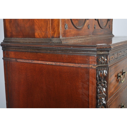 48 - A large 19th Century Victorian mahogany cupboard on chest having a double door cupboard top supporte... 