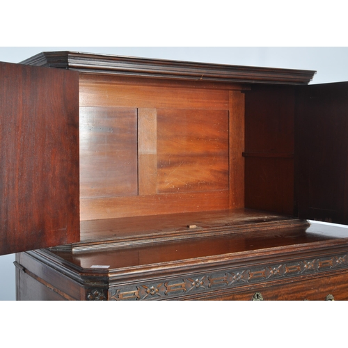 48 - A large 19th Century Victorian mahogany cupboard on chest having a double door cupboard top supporte... 