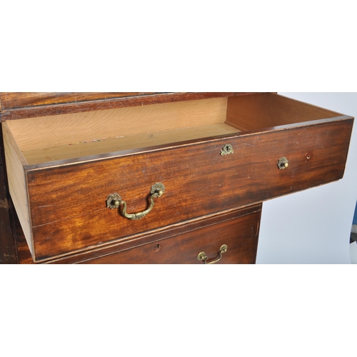 48 - A large 19th Century Victorian mahogany cupboard on chest having a double door cupboard top supporte... 