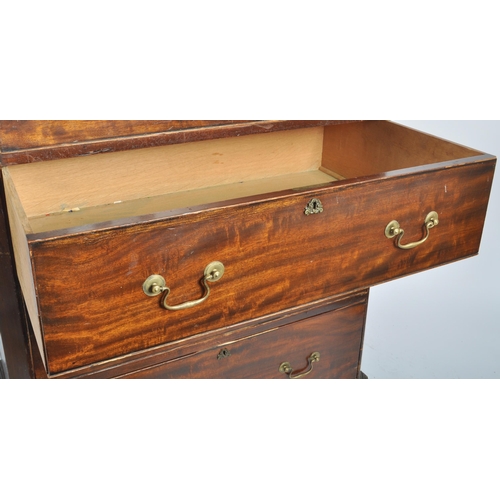 48 - A large 19th Century Victorian mahogany cupboard on chest having a double door cupboard top supporte... 