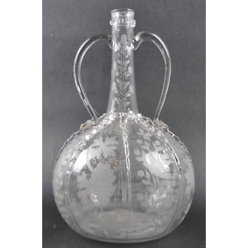 482 - A set of three 19th Century Dutch hand blown glass decanters. Each of bulbous bottle form with appli... 