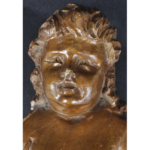 483 - An 18th Century carved wood religious ecclesiastical wall panel in the form of cherub / putti. The f... 