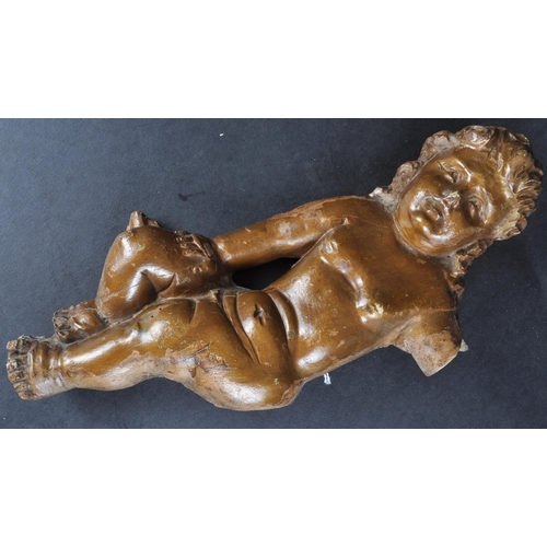 483 - An 18th Century carved wood religious ecclesiastical wall panel in the form of cherub / putti. The f... 