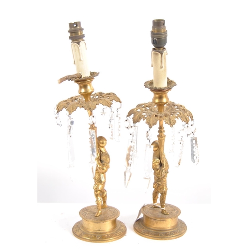 488 - A pair of early 19th Century Regency period bronze ormolu candlesticks in the form of soldiers holdi... 