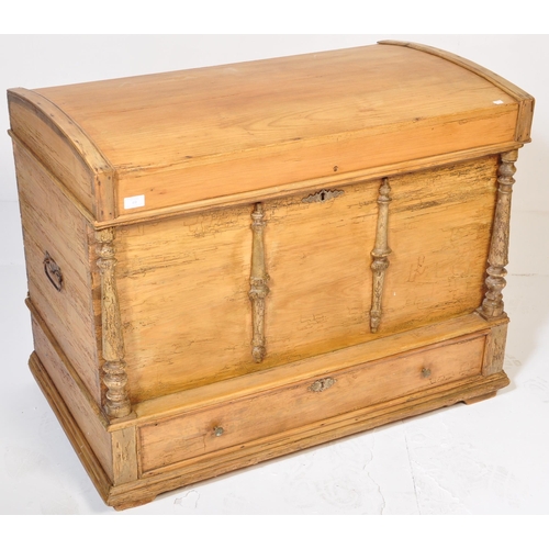 49 - A 19th Century pine blanket box chest steamer trunk. Domed top with carved columns to the front. The... 