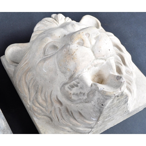 491 - Two early 20th Century composite stone lion mask wall plaques. Each with high relief lion face mask ... 