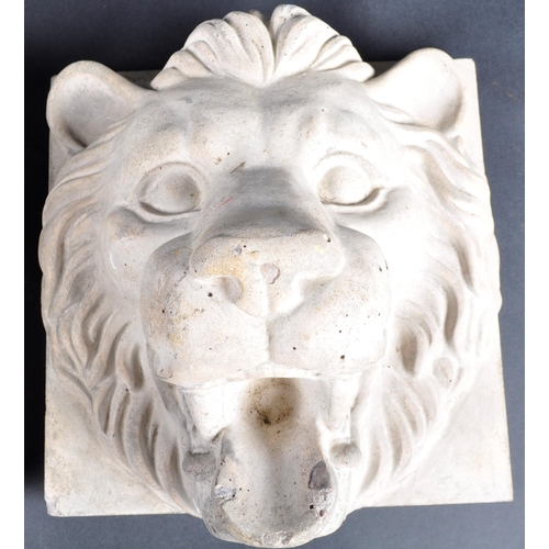 491 - Two early 20th Century composite stone lion mask wall plaques. Each with high relief lion face mask ... 