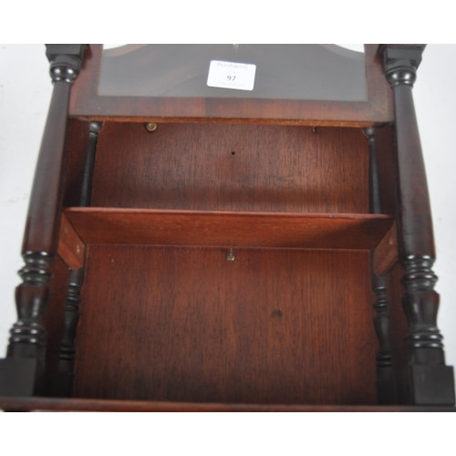 492 - A 19th Century mahogany wall collectors cabinet having a lift top glazed door with arched top set wi... 