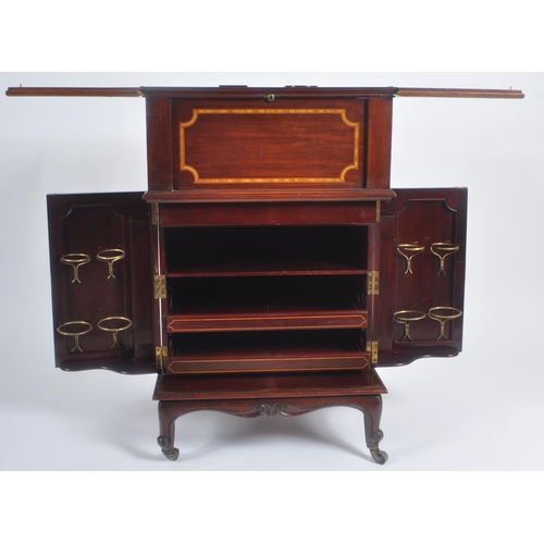 50 - An early 20th Century Edwardian mahogany inlaid drinks bar entitled The Eclipse. Twin folding doors ... 