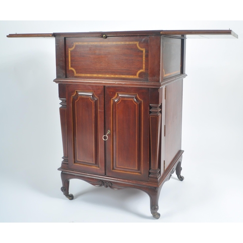 50 - An early 20th Century Edwardian mahogany inlaid drinks bar entitled The Eclipse. Twin folding doors ... 