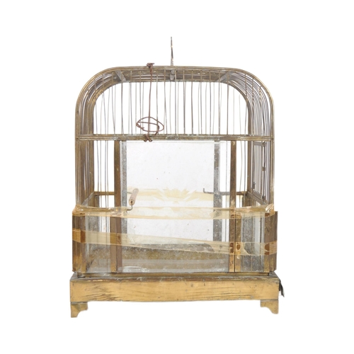 504 - A 19th Century Victorian birdcage. Typical form with wire cage and set with star engraved glass pane... 