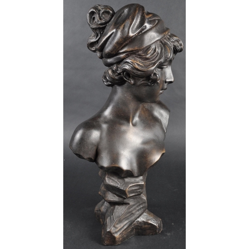 507 - A faux bronze statue bust study in the form of a young woman. Modelled with hair in cloth and detail... 