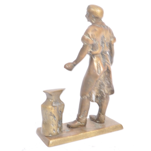 513 - A 19th Century Victorian bronze figurine. The figure depicting a blacksmith standing by anvil with s... 