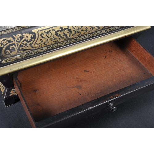 517 - A 19th Century Regency ebonised and Boulle work desk stand / tidy having a leaf work brass handle wi... 