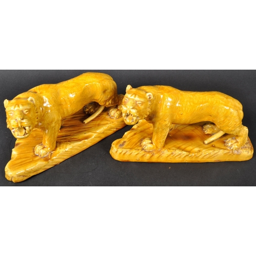 525 - A pair of 19th Century Victorian glazed ceramic tigers with each in a prowling position with mouths ... 