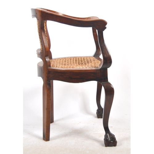 540 - A 19th Century mahogany captains chair / desk armchair having a shaped backrest & arms with bergere ... 