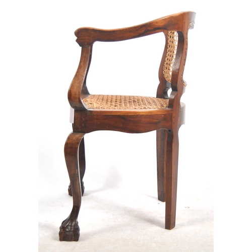 540 - A 19th Century mahogany captains chair / desk armchair having a shaped backrest & arms with bergere ... 