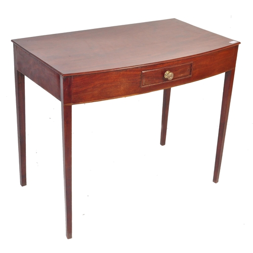 546 - An early 19th Century Georgian Regency mahogany side table. The serving table with bow front being r... 